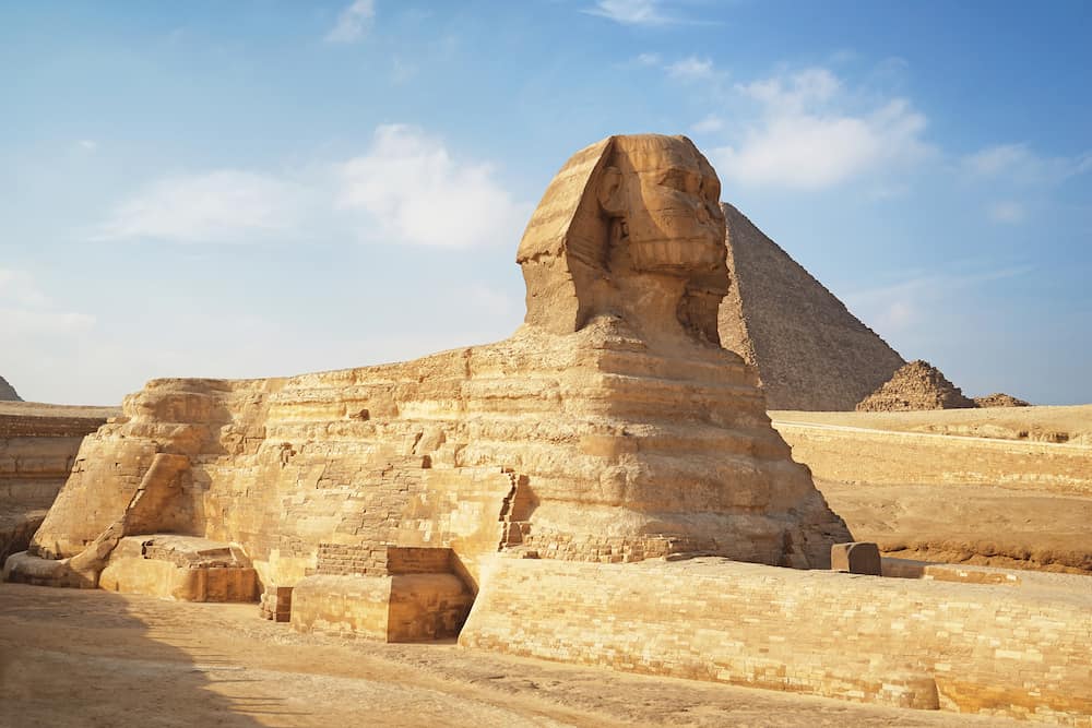 CAIRO, EGYPT - View of The Great Sphinx and pyramids on the Giza Plateau - one of the most famous tourist attractions in the world