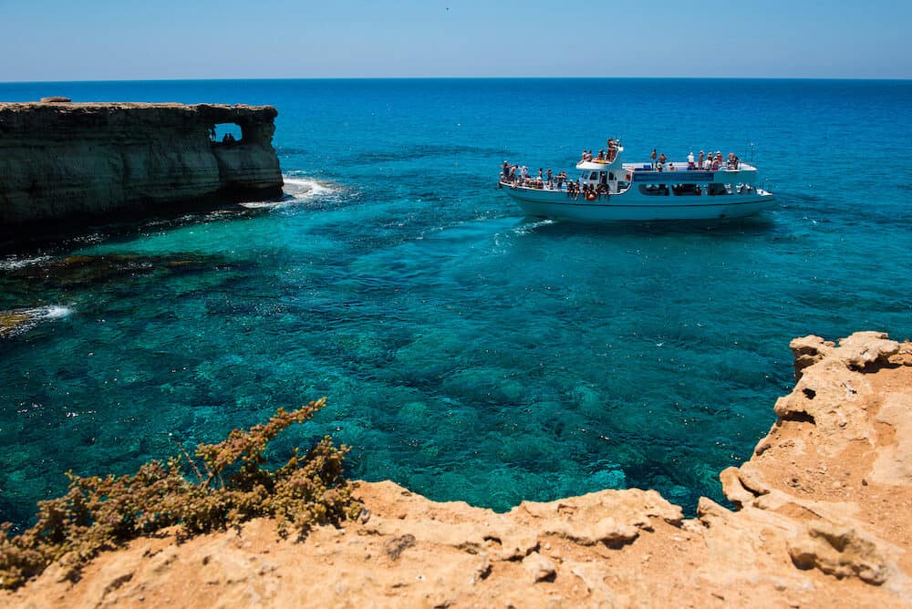 AYIA NAPA, CYPRUS, Tourists visiting the sea caves of Ayia Napa. The littoral caves are one of the major tourist attractions of the island of Cyprus