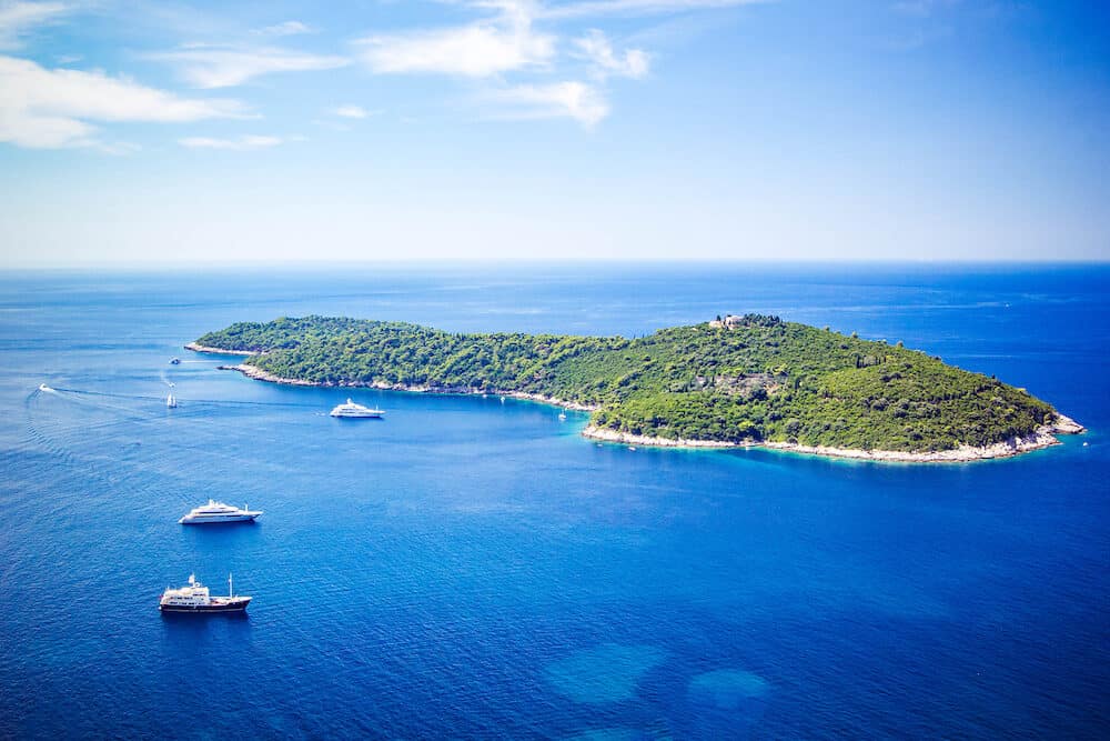 Panoramic view of Lokrum Island Dalmatian Coast of Adriatic Sea in Dubrovnik. Blue sea with white yachts, beautiful landscape, aerial view, Dubrovnik, Croatia
