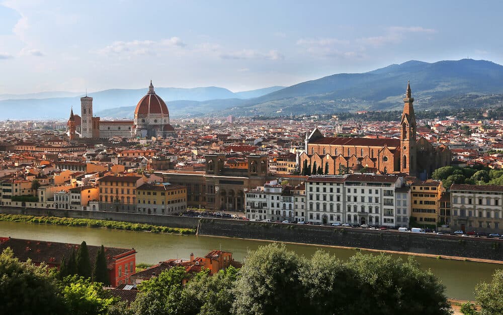 View of Cathedral of Santa Maria del Fiore (Florence Cathedral) and Basilica of Santa Croce during evening as viewed from Piazzale Michelangelo in Florence (Firenze), Tuscany, Italy