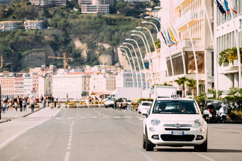 Naples, Italy -Fiat 500X Type 334 taxi car moving in Via Partenope Street. Subcompact crossover SUV manufactured and marketed by Fiat Chrysler Automobiles, since 2014.