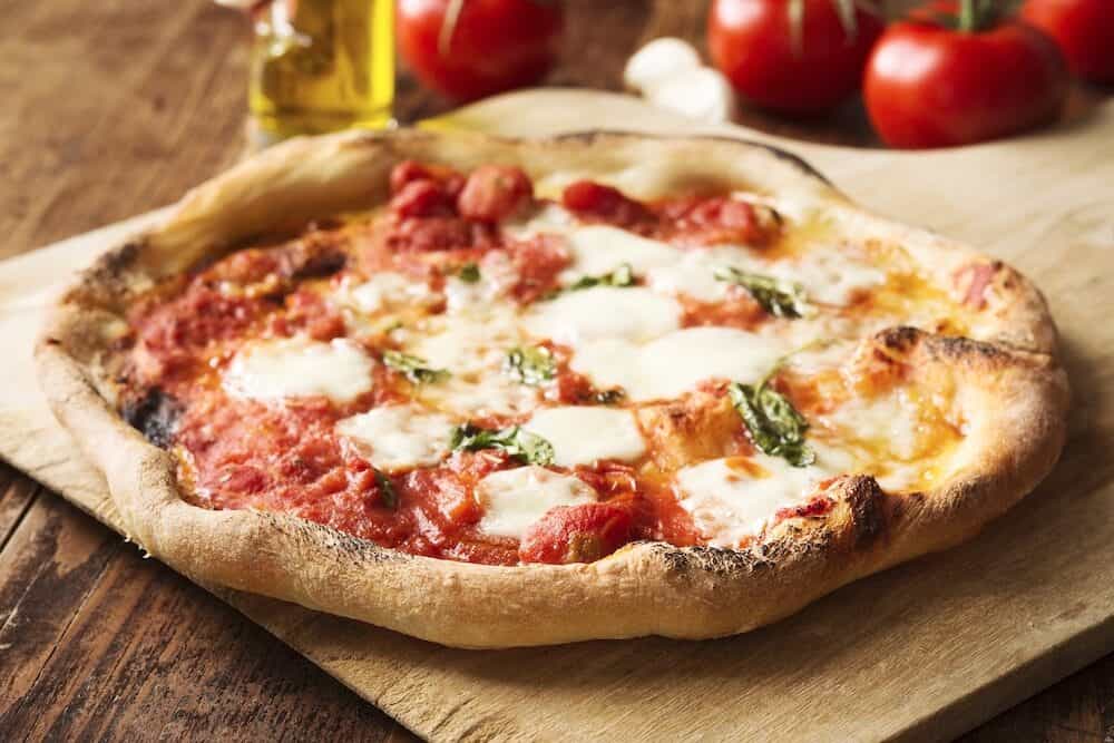Homemade Pizza Margherita with mozzarella and basil