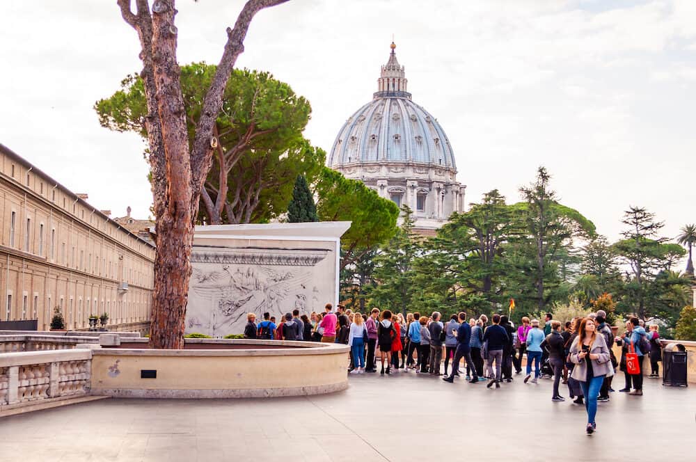 Vatican, Rome, Italy - Tourists in Pine outdoor yard of Vatican museums in Vatican city. The Galleries display works from collections built up by the Popes throughout the centuries