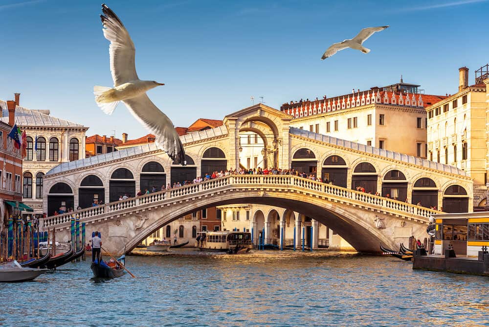 The old Rialto Bridge over the Grand Canal in Venice, Italy. Rialto Bridge (Ponte di Rialto) is one of the main tourist attractions of Venice.
