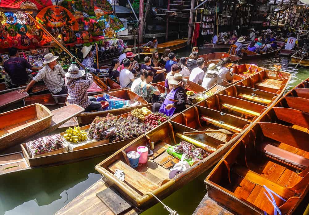 Bangkok Thailand - Many people at Damnoen Saduak floating market in Bangkok Thailand. This is the most famous of the floating markets in Thailand.