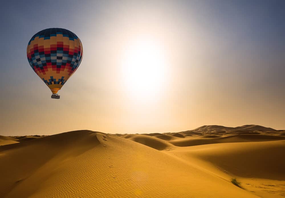 Desert and hot air balloon Landscape at Sunrise.