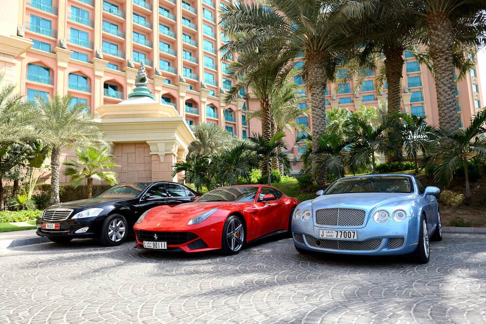 DUBAI UAE - The Atlantis the Palm hotel and limousines. It is located on man-made island Palm Jumeirah in Dubai United Arab Emirates