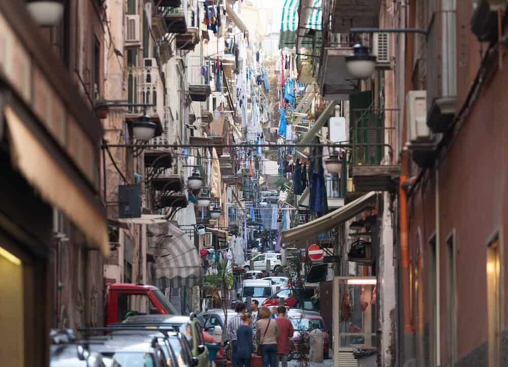 Naples Italy - The neighborhood called Quartieri Spagnoli in Naples in a typical day with colorful streets and fessed are a world attraction.