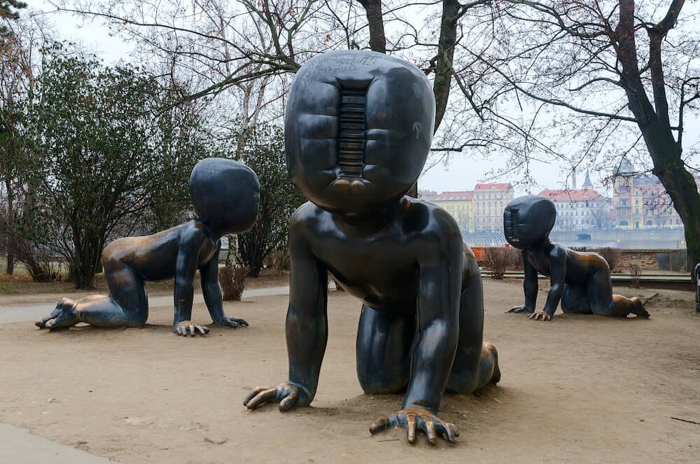 PRAGUE, CZECH REPUBLIC - Statues of black crawling faceless babies on Kampa Island, Prague, Czech Republic. Author - Czech architect David Chernyy