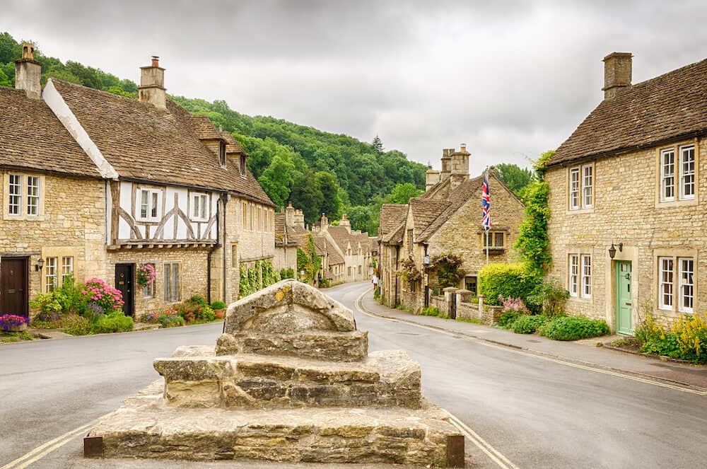 Historic houses in the Cotswold village of Castle Combe, described as the prettiest village in England and a major tourist destination close to the city of Bath and Stonehenge.