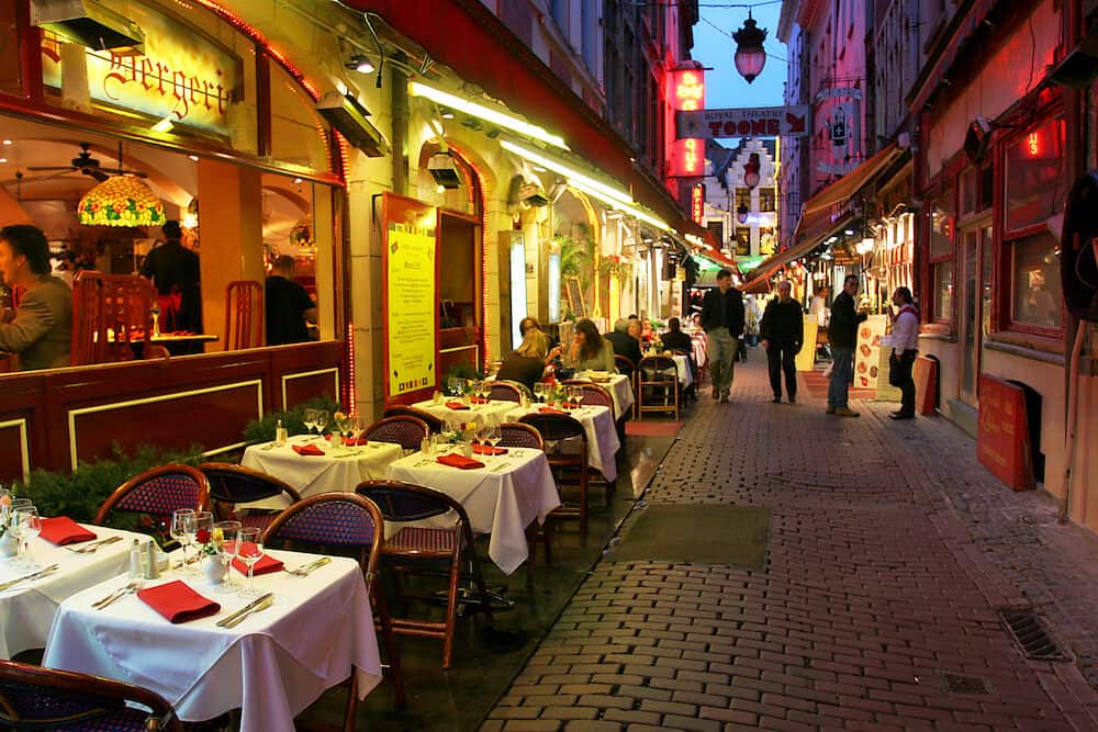 Restaurants and bars on evening streets of Brussels, Belgium.