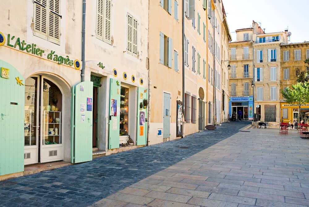 Marseille France - People and traditional stores in the main square of the old district Le Panier