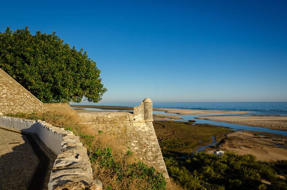 Cacela Velha is a lovely and small coastal town in the southern Portugal, in Algarve region. Located in the Ria Formosa Natural Park well worth a visit for its view over the sea and the sandy banks