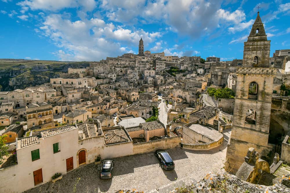 Matera, Italy - View of the Sasso Barisano, tower, old town, sassi caves and tourist area from the Convent of San Agostino, in the prehistoric city of Matera, Italy