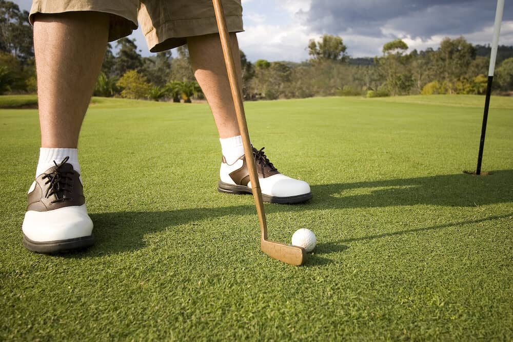 man about to putt at golf course in australia queensland