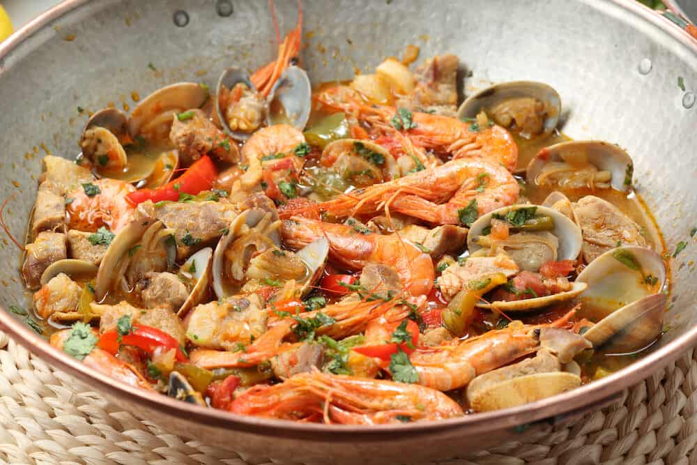Traditional portuguese seafood dish - cataplana-The cooking process used by the CATAPLANA prevents the loss of the ingredients' aromas, ensuring full and excellent flavor.