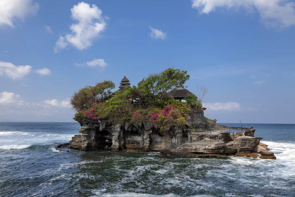 Tanah Lot water temple in Bali island, Indonesia. Outdoor Indonesia nature landscape. Tanah Lot water temple, Bali. Temple landmark in Bali, Indonesia. Bali water temple. Famous Indonesia water temple
