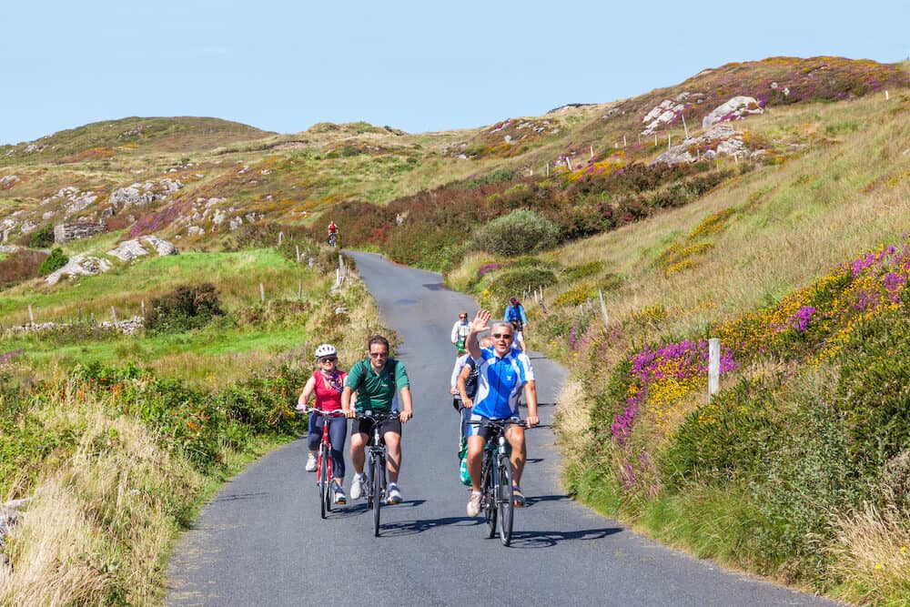 CLIFDEN, IRELAND - Unidentified cyclists riding along the Sky Road, near Clifden in County Galway, Ireland.