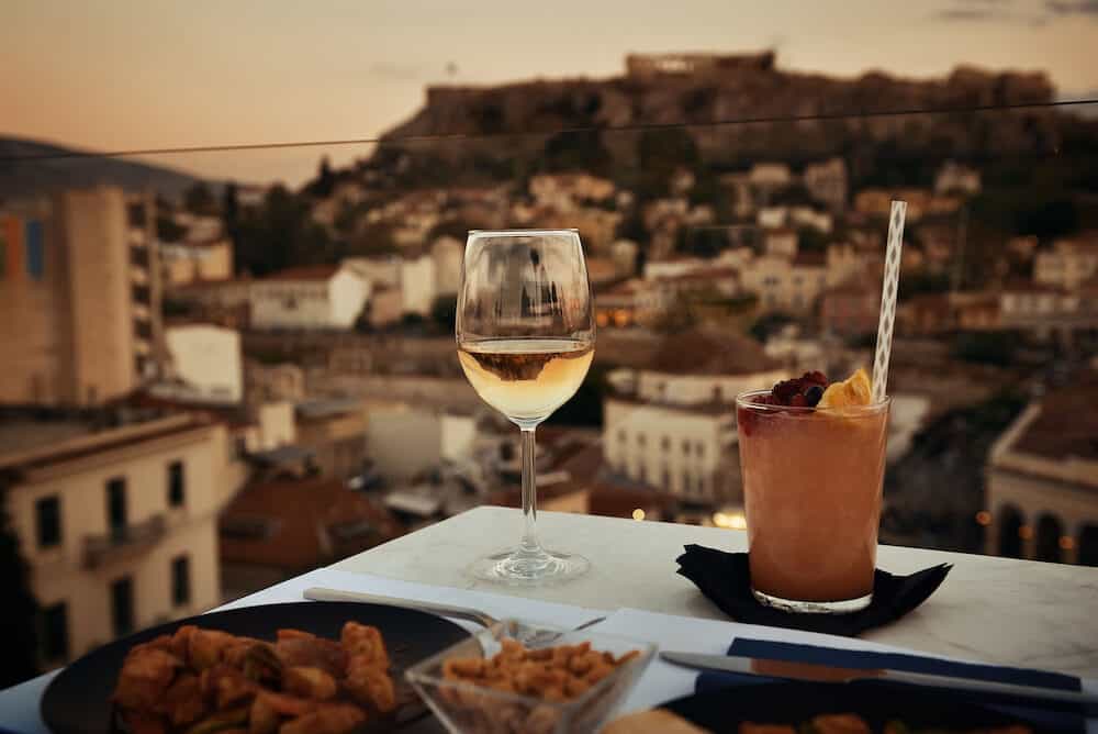 Dinner at rooftop with the view of Acropolis in Athens, Greece.