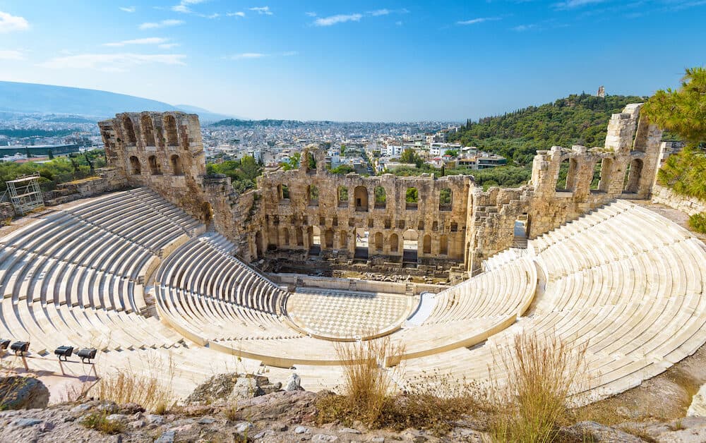 Panoramic view of the Odeon of Herodes Atticus at the Acropolis of Athens, Greece. It is one of the main landmark of Athens. Scenic panorama of Herod Atticus Odeon overlooking Athens city in summer.