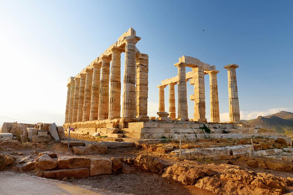 The Ancient Greek temple of Poseidon at Cape Sounion, one of the major monuments of the Golden Age of Athens. Scenic temple ruins with Doric-style columns, offering sweeping views of the sea.