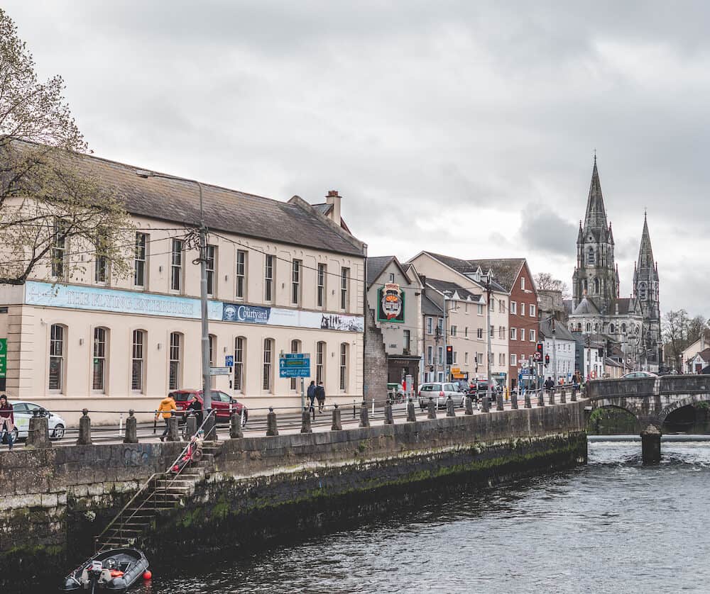 Cork, Ireland - Sullivan Quay street, the Nano Nagle Bridge over river Lee, and Saint Fin Barre Cathedral in the background.