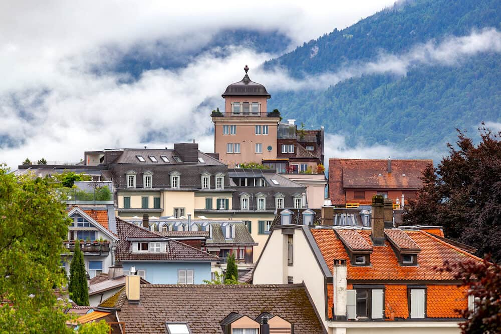 Interlaken. Aerial view of the city rooftops and mountains.