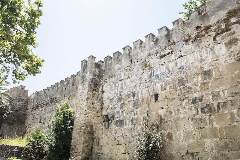 wall and tower of medieval castle in Marbella Andalucia Spain
