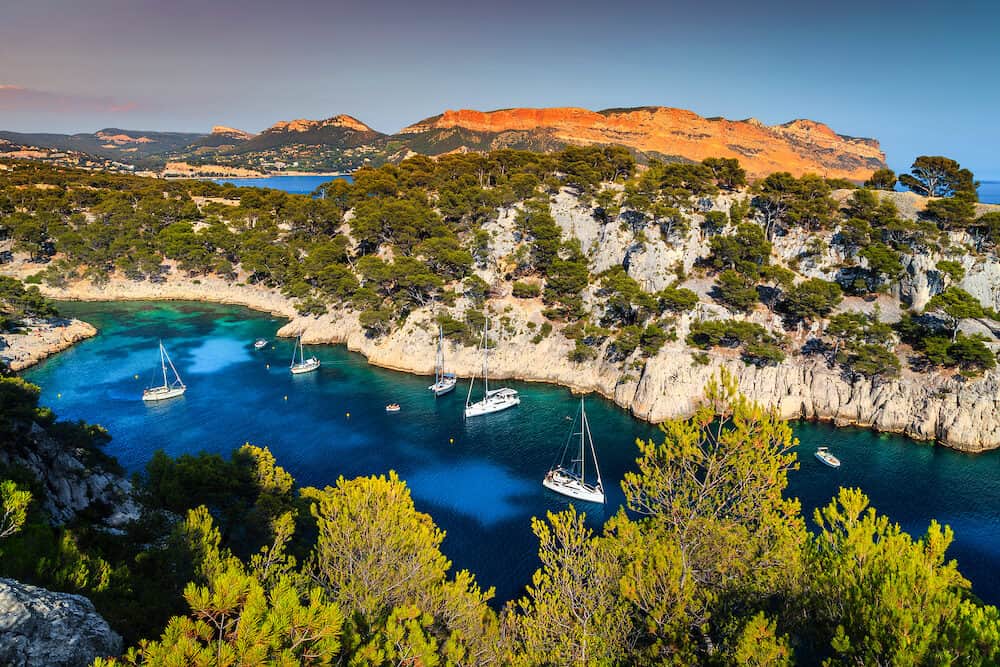 Beautiful mediterranean travel destination, Calanques de Port Pin bay with luxury yachts harbor and sailing boats, Calanques National Park, Cassis resort, Provence, France, Europe