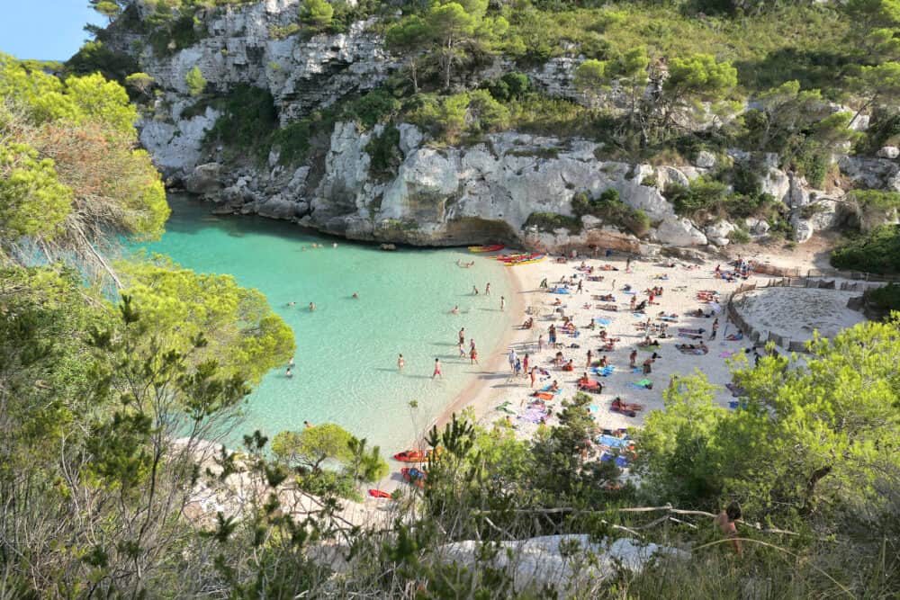 Beautiful beach with turquoise water in bay Cala Macarelleta on Menorca island in Spain.