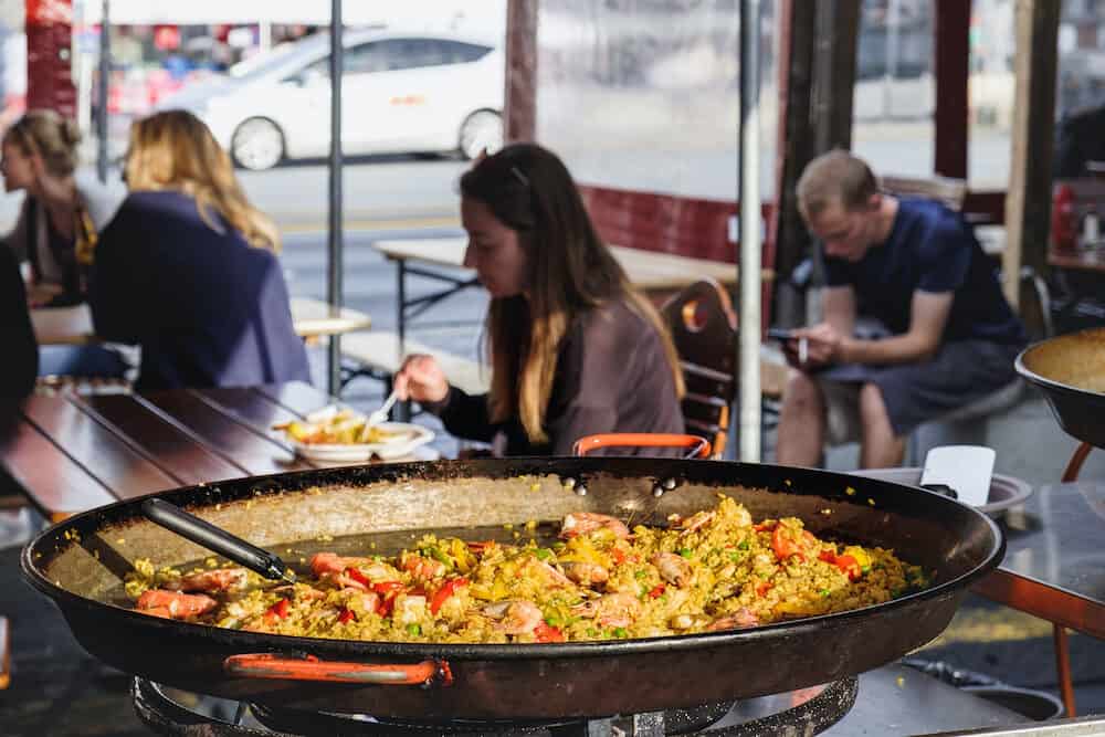 Bergen, Norway - Large pan with paella with seafood at Bergen Fish Market, Norway. Street Food ready to eat