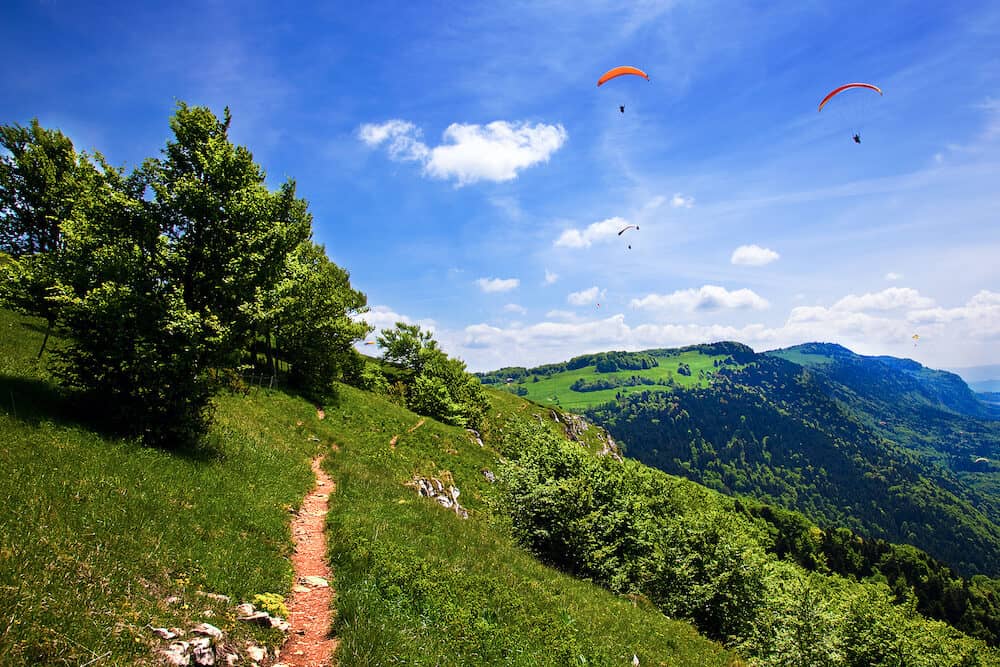Paragliding in the blue sky in summer