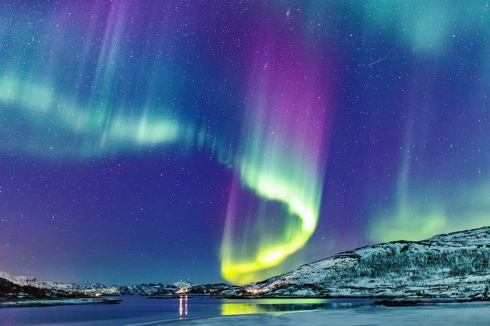 Incredible Northern lights Aurora Borealis activity above the coast