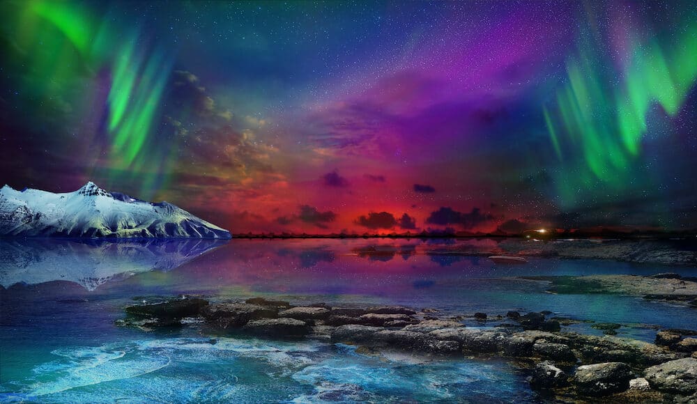 Beautiful northern lights of the northern part of the planet. Magnificent views of the ocean and northern lights with rocks and stones. Beautiful sea water plays with colors and light