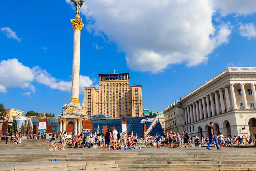 Kiev, Ukraine - Unknown people walking, taking photos and resting on Independence Square (Maidan Nezalezhnosti) in Kiev, capital of Ukraine