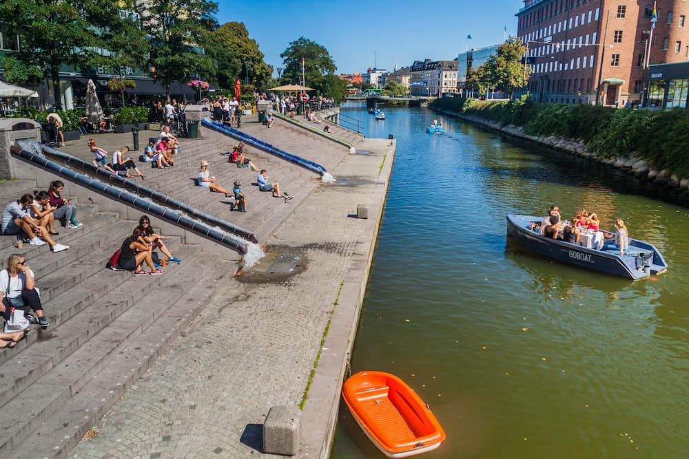 MALMO, SWEDEN - People enjoy a sunny day at Rorsjo canal in Malmo, Sweden.