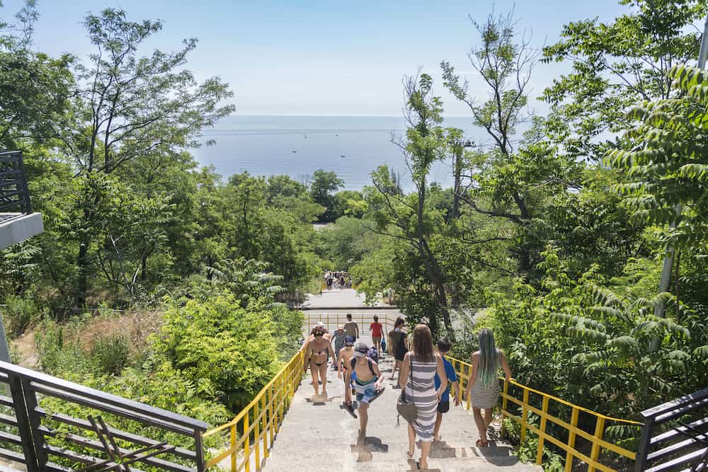 At stairs to 15 Fontana beach of Odessa, Ukraine: People walking to the beach 15 Fontana in Odessa, Ukraine