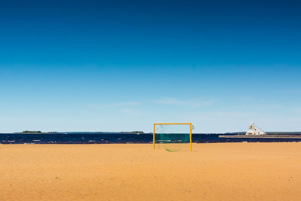 A football goal on an empty beach in the Northern Finland on a windy summer day.
