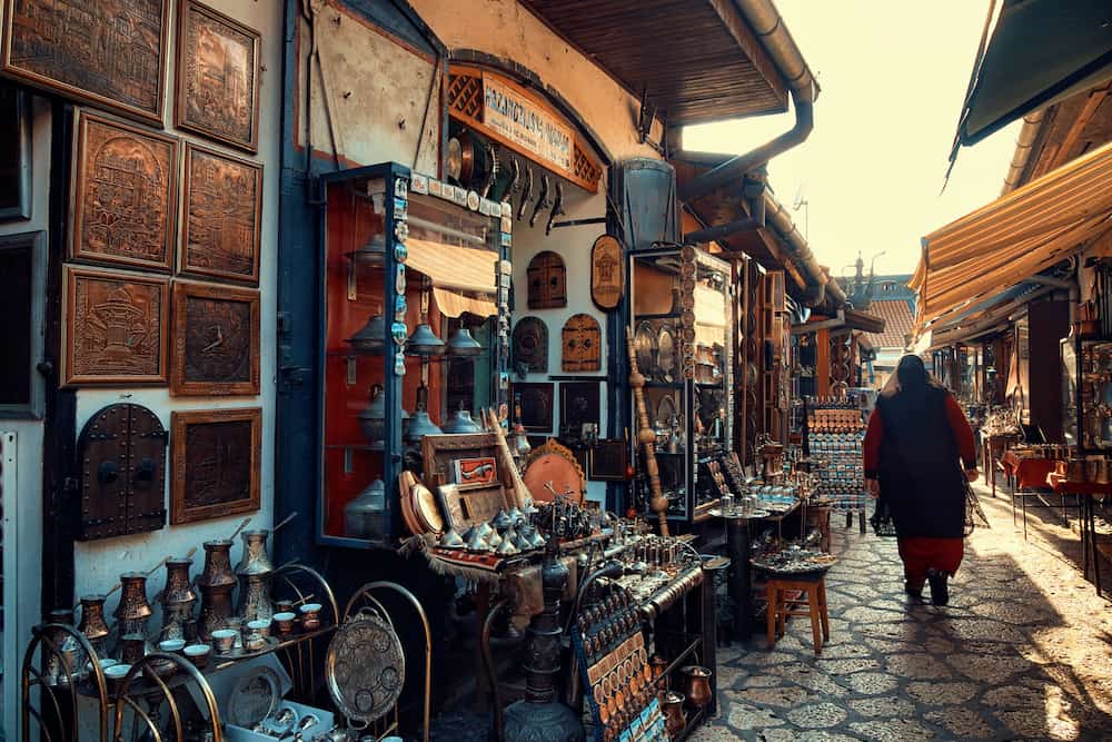 SARAJEVO, BOSNIA AND HERZEGOVINA - muslim woman walking in Old Sarajevo street bazaar