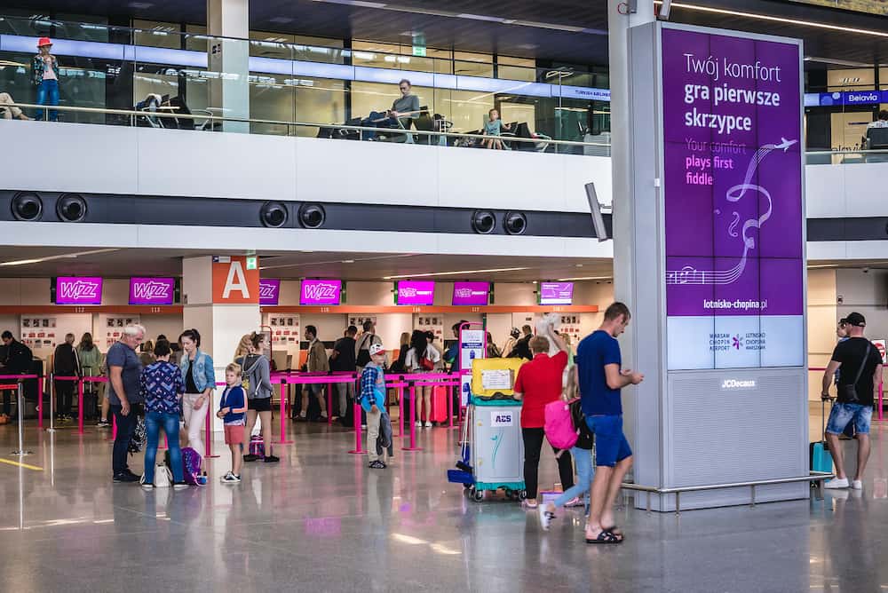 Warsaw, Poland - Interior of Warsaw Chopin Airport in Warsaw city, view with WizzAir check ins on background