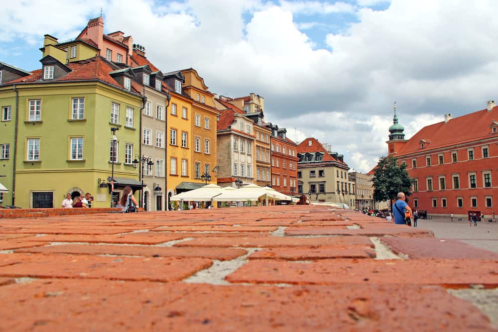 Warsaw / Poland. Warsaw square panorama from red brick surface. Touristic place in center of old city of Warsaw. Old houses in Warsaw. Panorama of central part of Warsaw