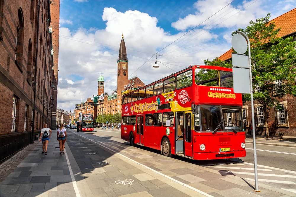 Copenhagen, Denmark - Red city tour bus hop on hop off in the center of Copenhagen, Denmark.
