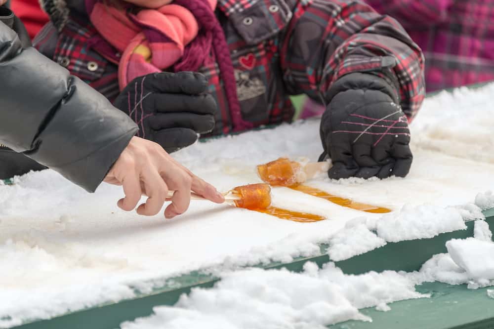 Maple taffy on snow at the sugar shack in Montreal Canada