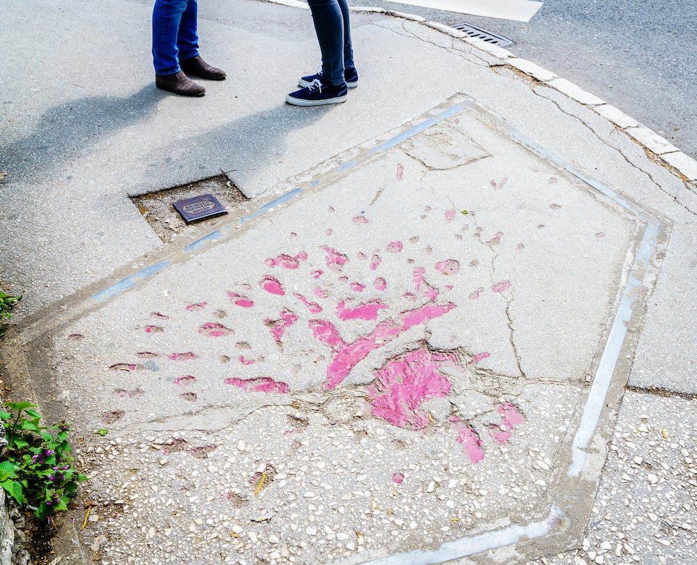 Markings on the streets of Sarajevo indicating where mortar shells exploded during Bosnian war in 1990s