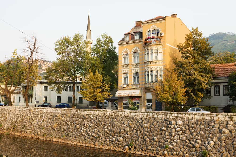 SARAJEVO, BOSNIA AND HERZEGOVINA - : The houses on embankment of the Miljacka river in Sarajevo city. Sarajevo is the capital of Bosnia and Herzegovina.