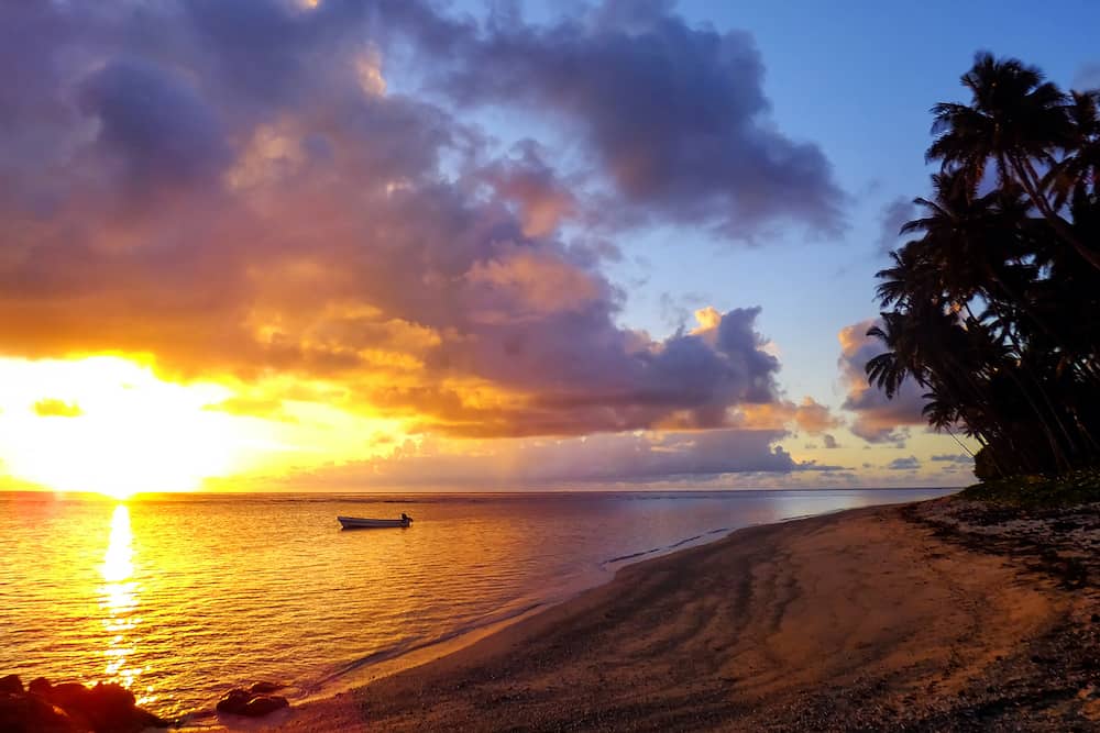 Colorful sunrise on the beach in Lavena village on Taveuni Island, Fiji. Taveuni is the third largest island in Fiji.