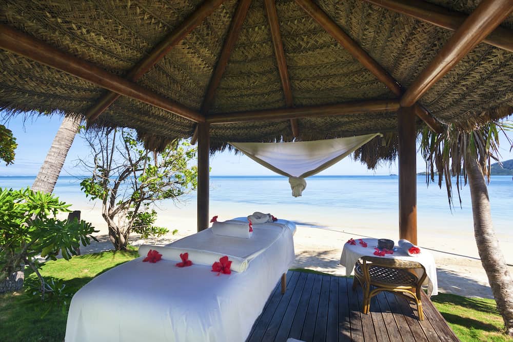 Massage hut with bed on tropical Fiji beach