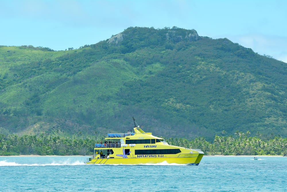 The bright yellow and fast catamaran Yasawa Flyer Fiji. It's a famouse high speed ferry transfers between the main island on Fiji and Yasawa & Mamanuca Island resorts.
