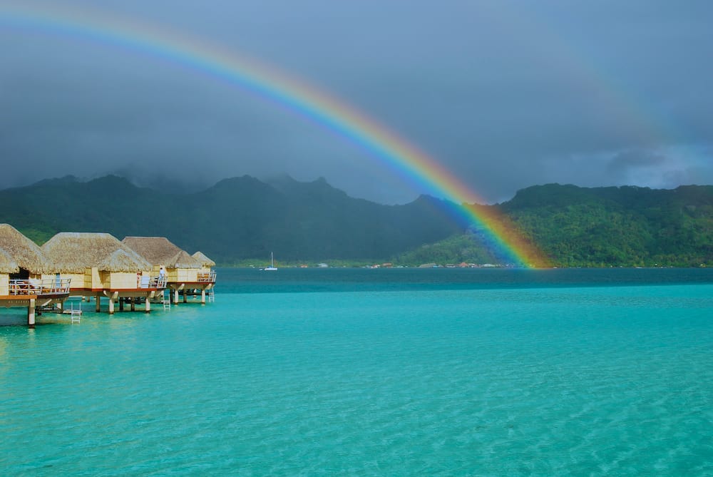 Double rainbow on top of Polynesia over-water luxury bungalows