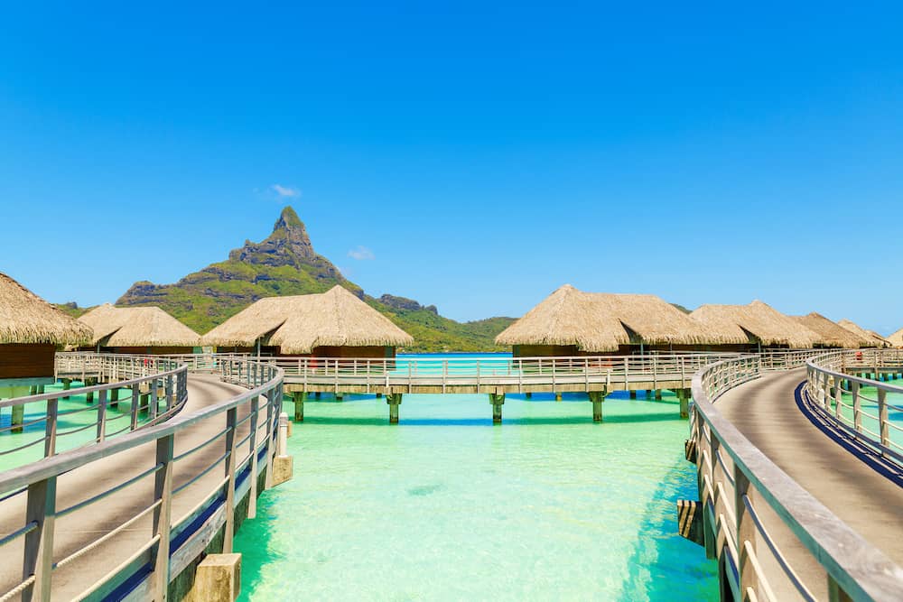 Over water villas on a tropical lagoon of Bora Bora Island Tahiti French Polynesia